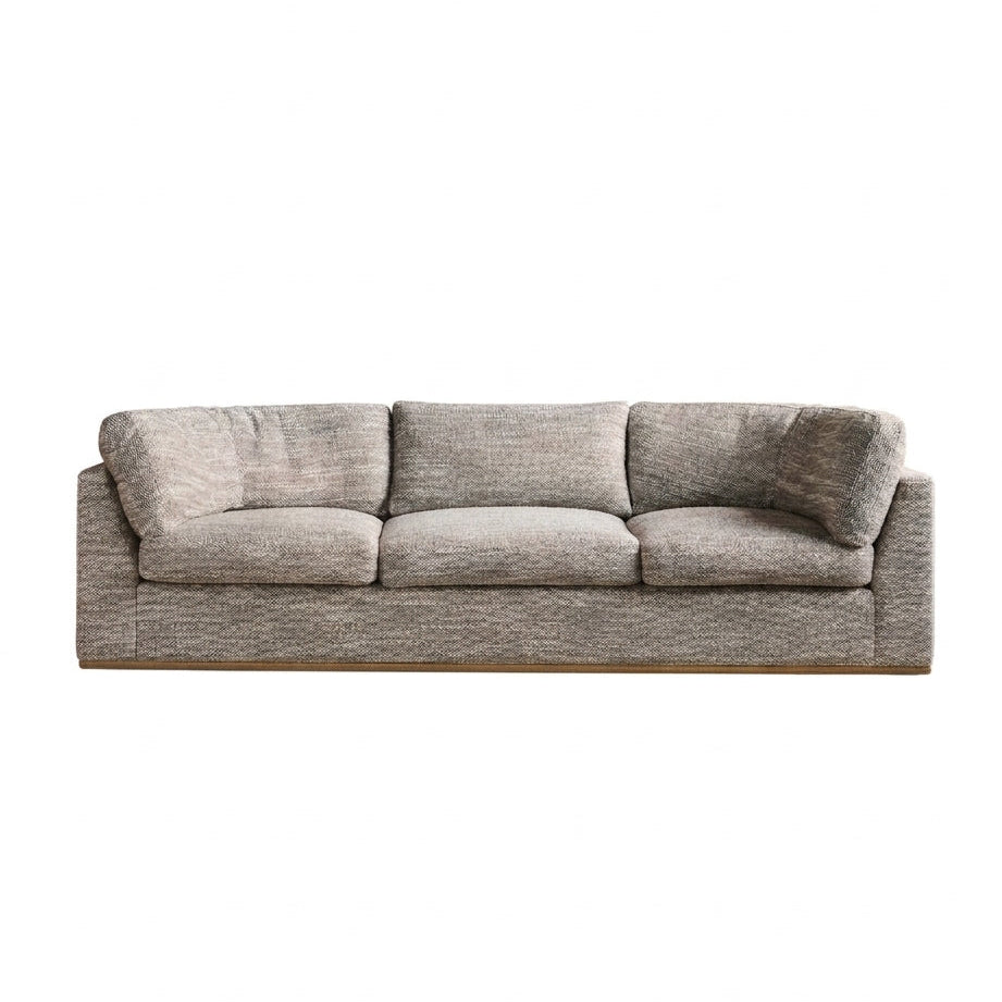 Sabrina Curved Sofa on leather plinth in Matrix Woven Dream with Tan Leather plinth