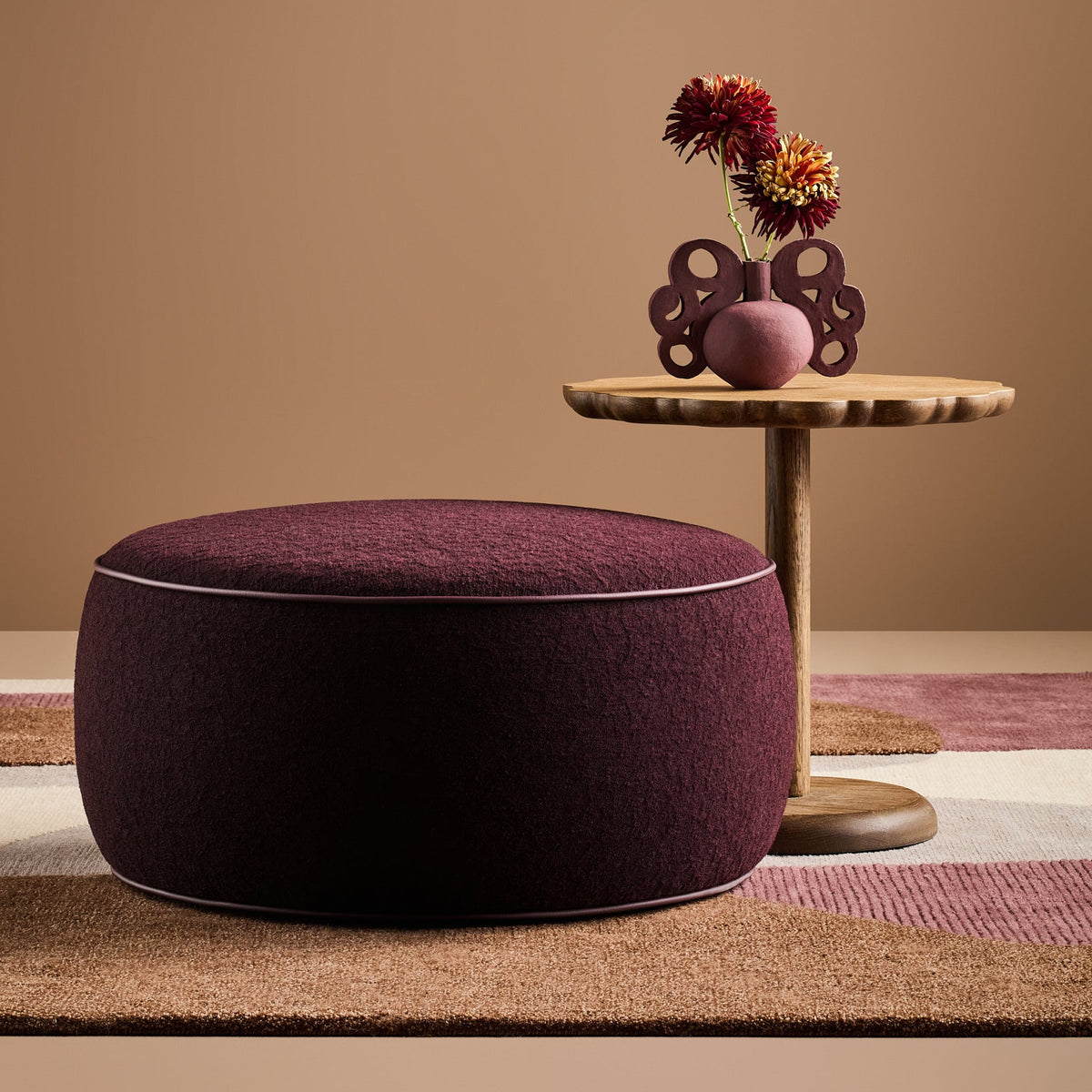 Jewel Upholstered Ottoman in Grainscape Pinot Noir with Burgundy Faux Leather piping