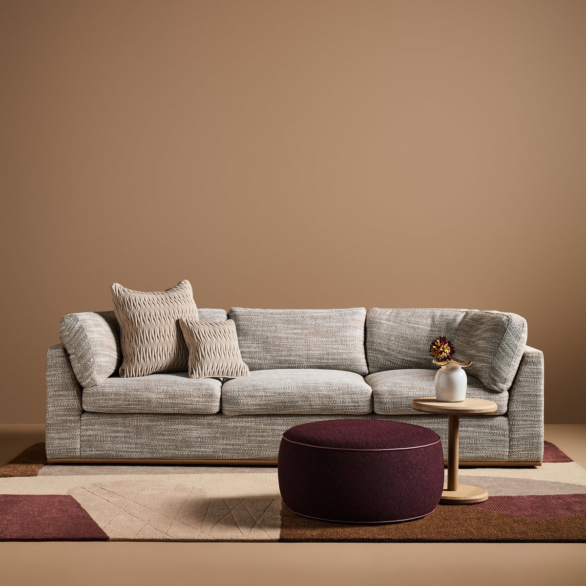 Jewel Upholstered Ottoman in Grainscape Pinot Noir with Burgundy Faux Leather piping
