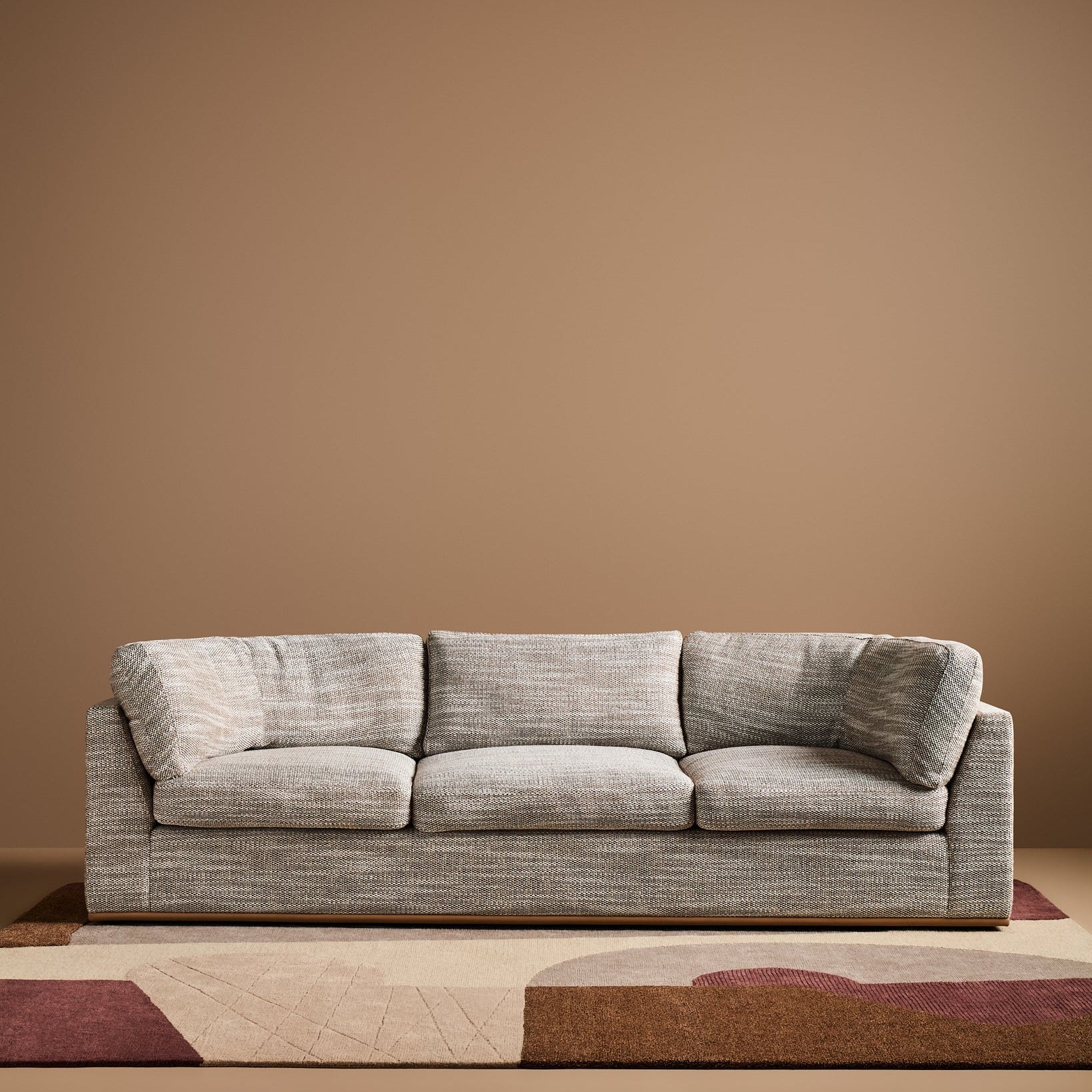 Sabrina Curved Sofa on leather plinth