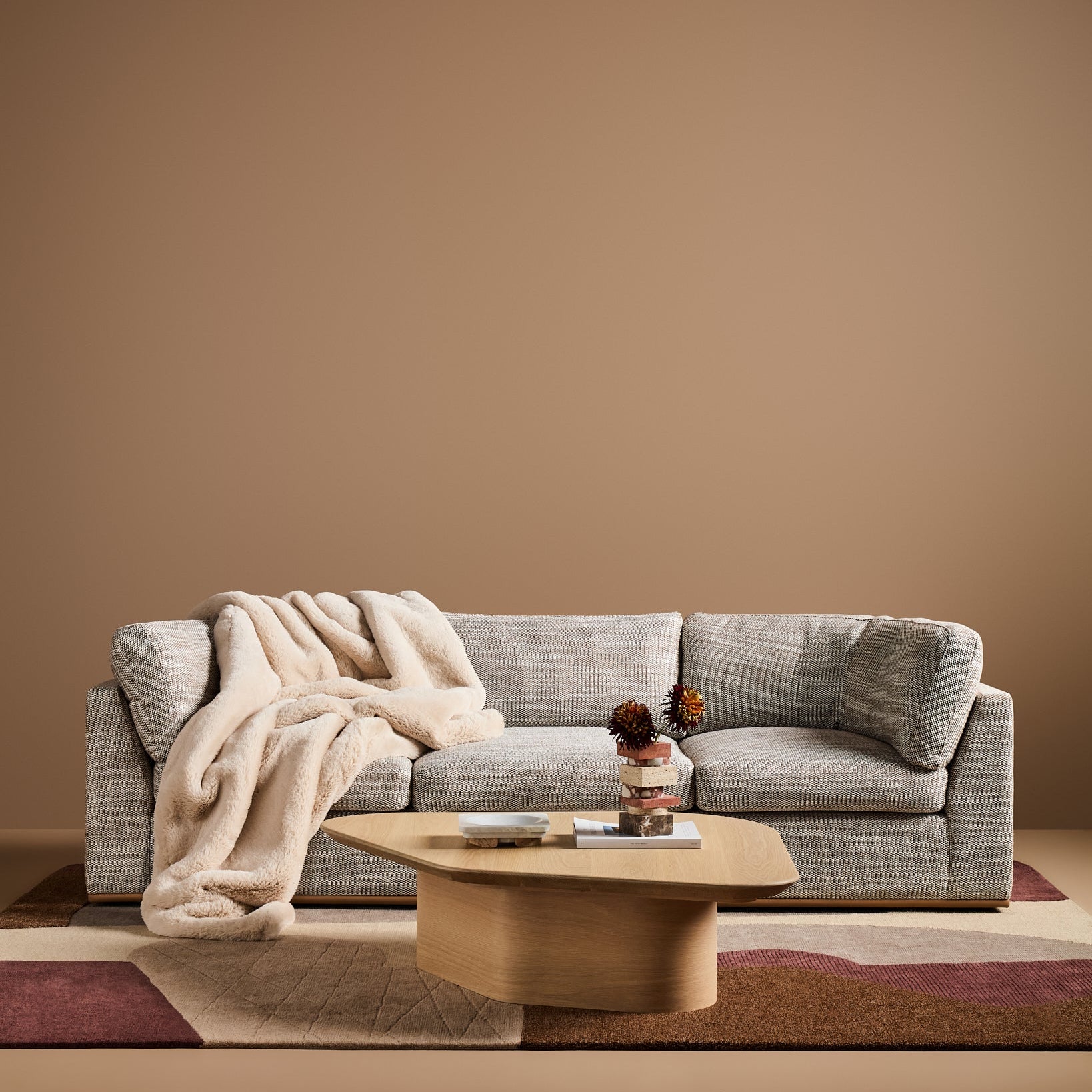 Sabrina Curved Sofa on leather plinth