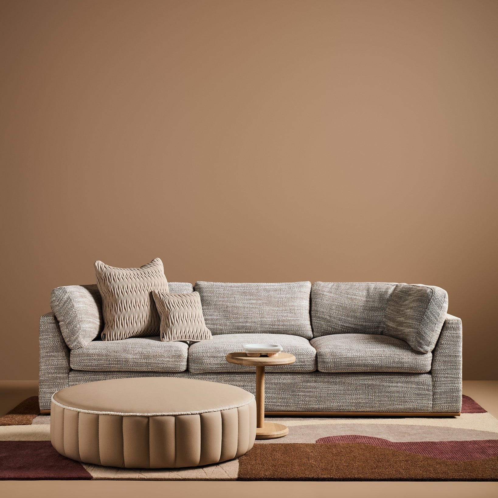 Sabrina Curved Sofa on leather plinth